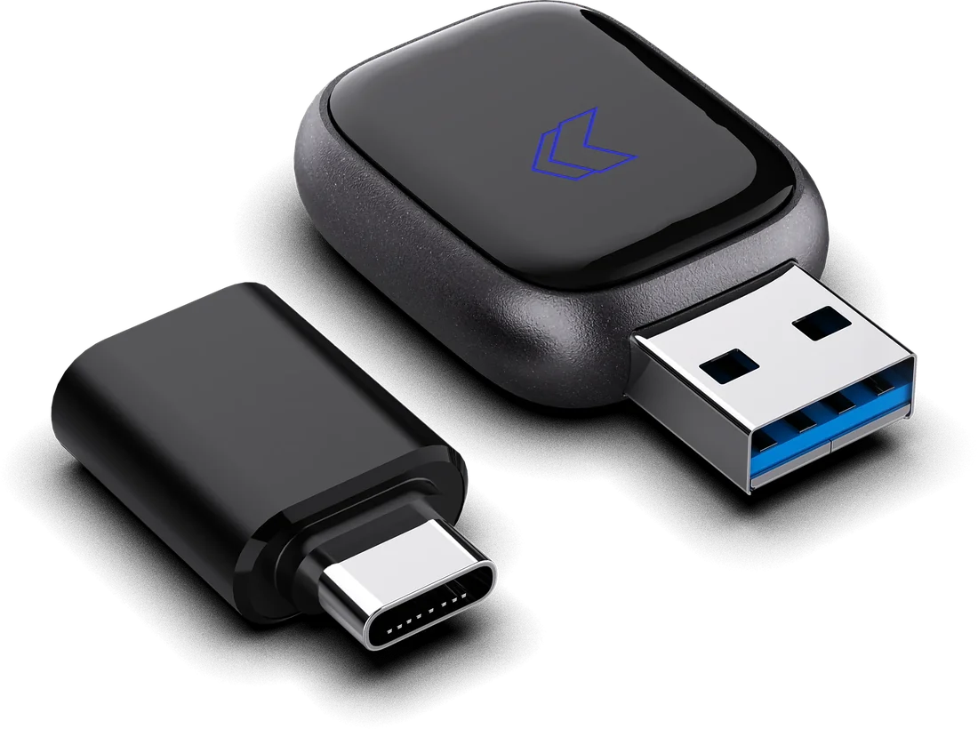 FT-AIR com conector USB-A ao lado do adaptador USB-C incluso